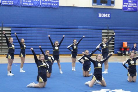 Ready. Set! The Chelsea cheer team strikes a pose on the mat