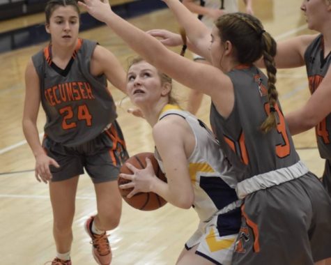 Tecumseh towers over as Chelsea’s JV team fights for a clear shot at the hoop while freshman Lilly McCalla searches for a way around the opposing players.