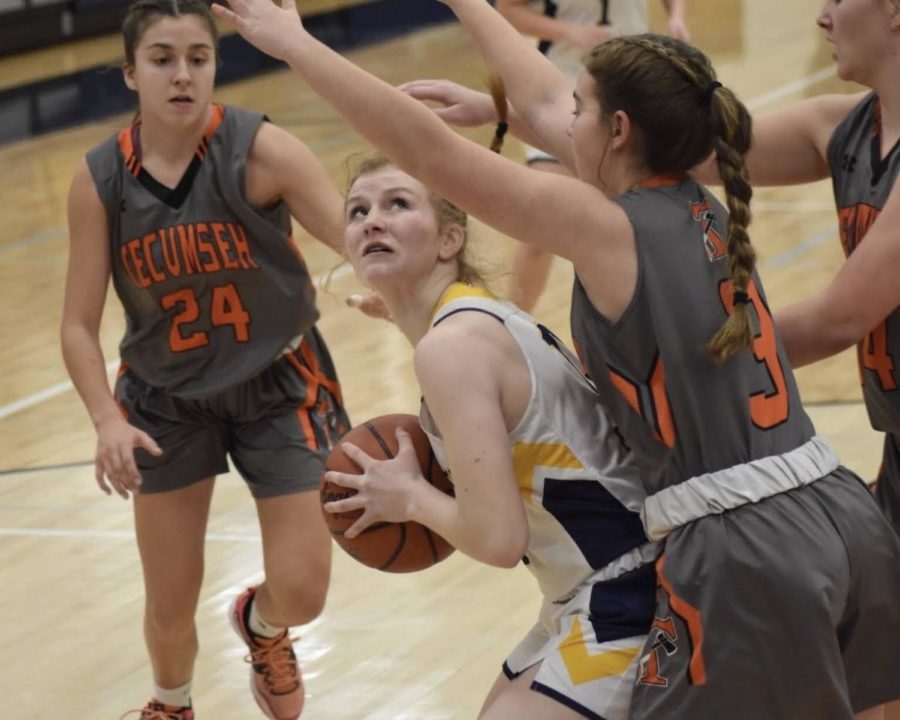 Tecumseh+towers+over+as+Chelsea%E2%80%99s+JV+team+fights+for+a+clear+shot+at+the+hoop+while+freshman+Lilly+McCalla+searches+for+a+way+around+the+opposing+players.