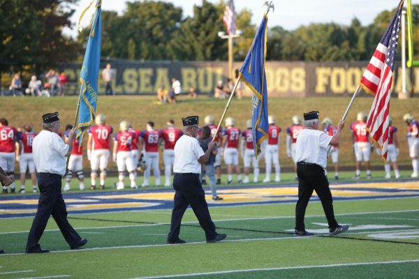 Varsity Football Red, White, and Blue Dogs Game Honors Veterans