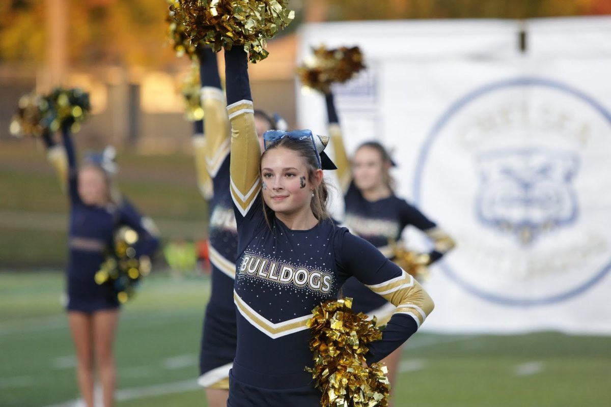 Junior Breanne Dolph Cheering Underneath The Friday Night Lights