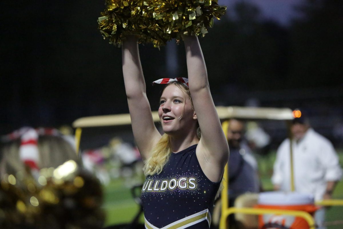 First-Year and Fearless: Senior Cheerleader Takes Charge with Blue and Gold Leadership