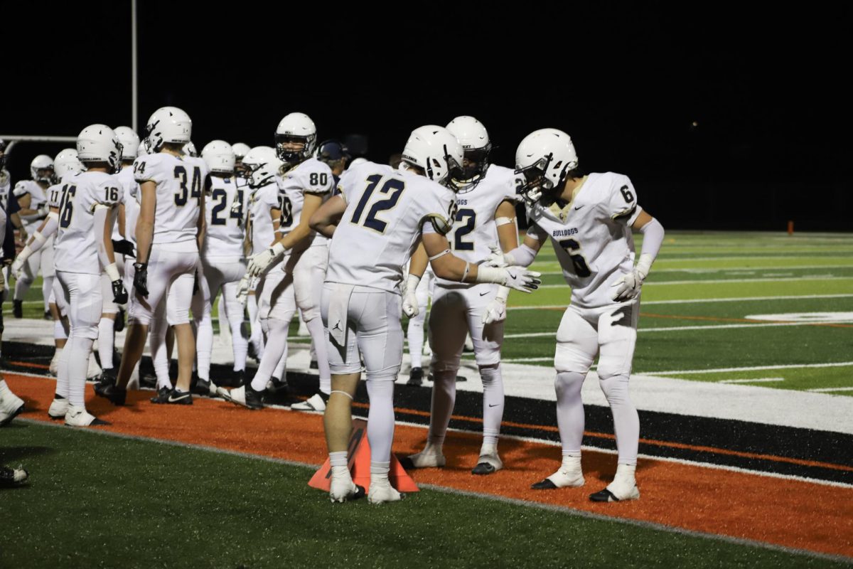 Seniors Beckett Boos and AJ Smith celebrating after a interception 