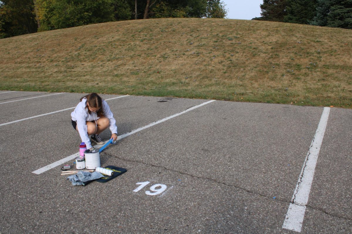 Amelia Fulton planning and marking out her parking spot