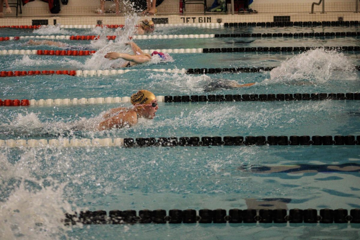 Junior Brooke Paddock pushing to reach the wall of her 200 IM